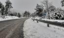Nieve, este sábado, en la carretera de acceso a la ciudad encantada y el río Cuervo