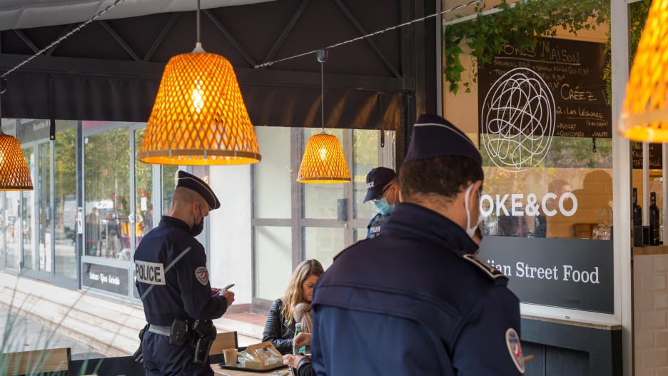 November 24, 2021, Draguignan, Var, France: Police officers are seen checking the health pass of a customer in a restaurant..Due to a surge in Covid-19 positive cases, the French government has decided to reinforce the controls on the obligation of the Sa