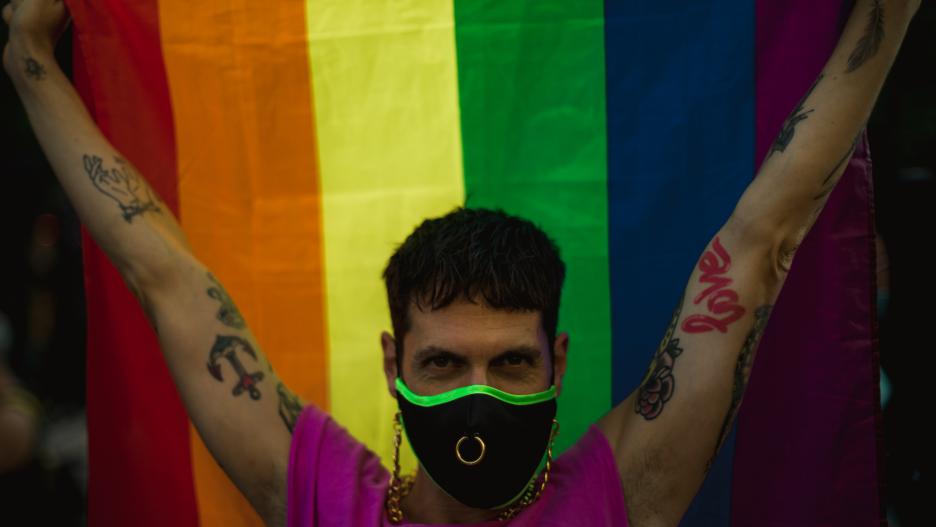 22 July 2021, Spain, Barcelona: A member of the LGBT community takes part in a protest against homophobia and transphobia. After the homophobic crime of Spanish 24 years-old Samuel Luiz, thousands of people went to the street in memory of Samuel Luiz and 